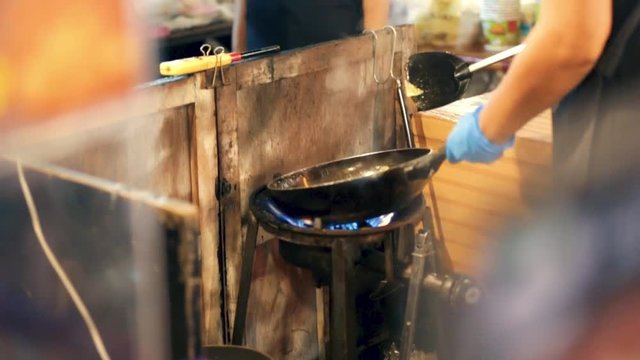 Cooking street food in phuket old town sunday market