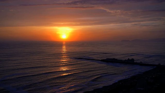 Golden seascape sunset over the Miraflores Latin American coastal beach Region of Lima Peru South America 