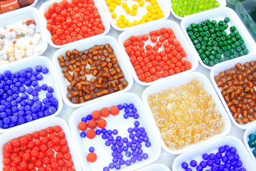 Color bead in plastic tray