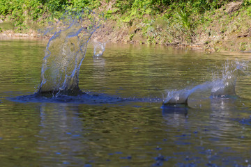Water splash games in stones.