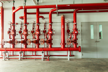 Red water pipe valve,pipe for water piping system control and Fire control system in industrial building or business building - obrazy, fototapety, plakaty