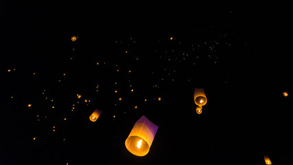 Lanterns in the sky being released in chiang mai for the lantern festival