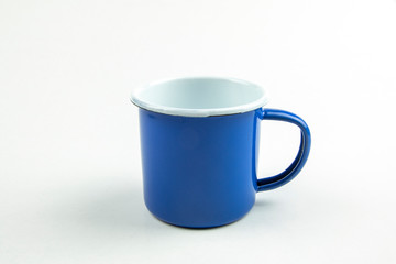 Blue tin cup.
