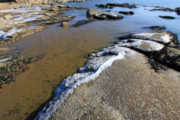 Sea reefs under the blue sky