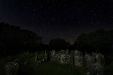 Dolmen of the Great Oak. Night landscape with ancient prehistoric dolmen. Montehermoso....