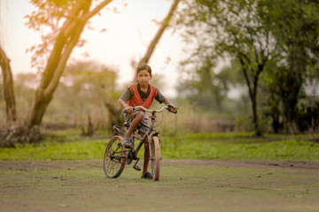 Fototapeta na wymiar indian child on bicycle