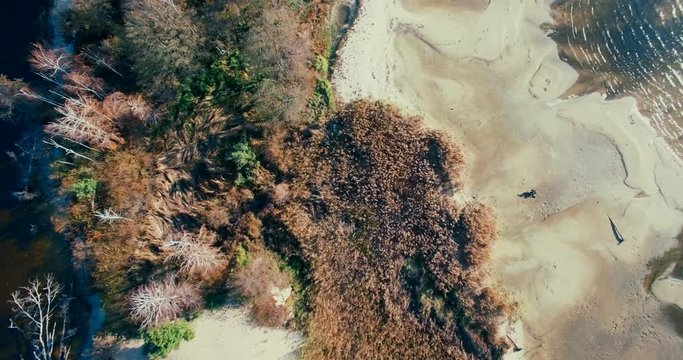 Aerial Drone small island on river and lake on autumn in golden hour.Kiev sea river island aerial drone fotage. The camera flies around the small round island. drone footage aerial view from above. 
