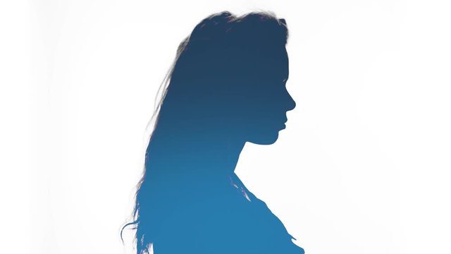 Abstract stylized blue silhouette of a beautiful young woman with her hair blowing in the breeze on a white background