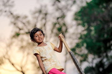 indian girl child playing cricket