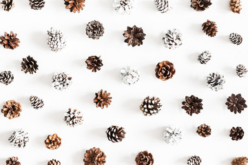 Christmas composition. Pattern made of pine cones on white background. Christmas, winter, new year concept. Flat lay, top view