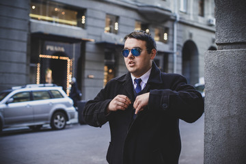 Worried man with overweight at city streets. Life of businessman or manager, office worker. Plump guy at center in sad mood  