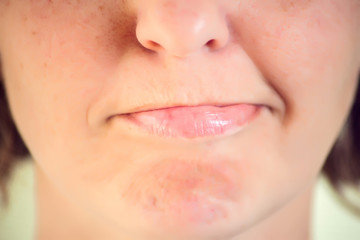 Fototapeta premium Close-up mouth of woman - lips zone. Emotions concept
