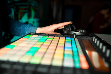 mixer and a DJ booth in the nightclub at a party with a diffuse bright background