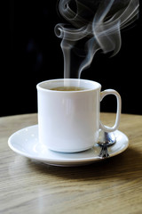 Hot coffee on the wooden table
