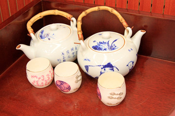 Ceramic teapot in the brown desktop