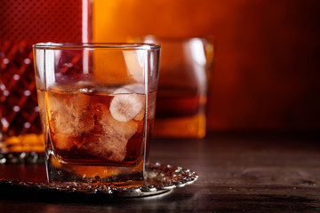 Glass of scotch whiskey and natural ice .