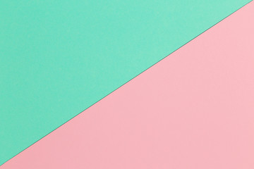 Pink and mint paper texture background.