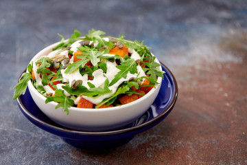 garden with pumpkin and arugula