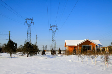 Cabin and pylon in the snow