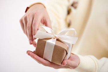 hands holding craft gift box