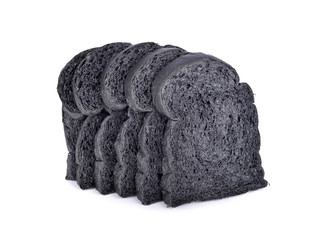 fresh sliced black charcoal bread on white background