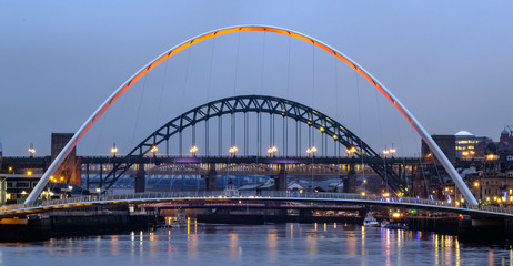 Fototapeta na wymiar Gateshead Millennium Bridge and the Tyne Bridge