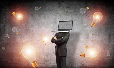Businessman with laptop instead of head.