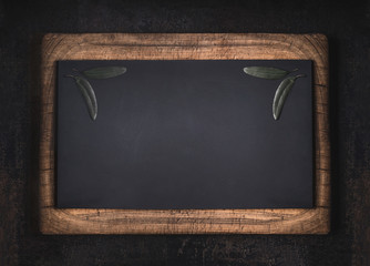 Black chalkboard in wooden frame background