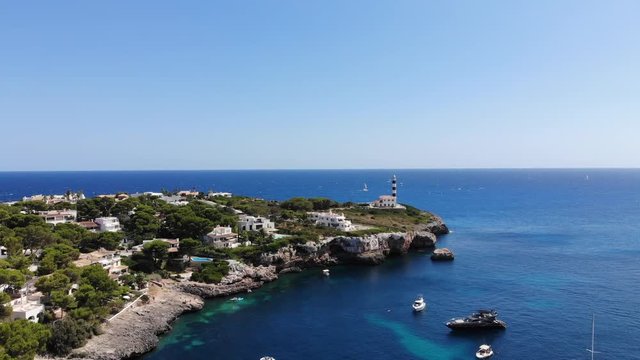 Flight over the bay of Portocolom, village Portocolom, Felanix region, Punta des Jonc and Bay of Cala Marcal, Mallorca, Balearic Islands, Spain