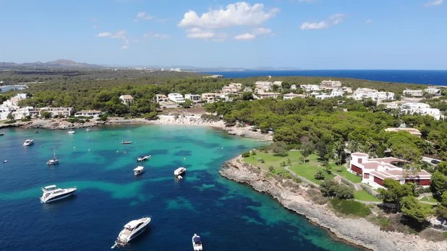 Flight over the bay of Portocolom, village Portocolom, Felanix region, Punta des Jonc and Bay of Cala Marcal, Mallorca, Balearic Islands, Spain