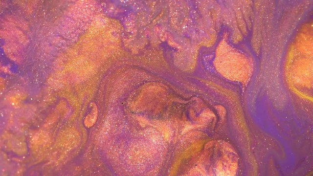 Copper and purple liquid flowing. Glitter Paints in Motion
