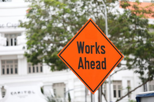 Works ahead road sign