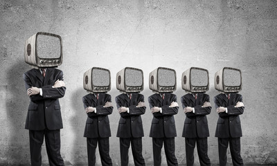 Businessmen with old TV instead of head.
