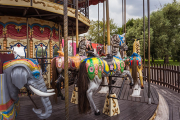 Old carousel in the amusement Park without people