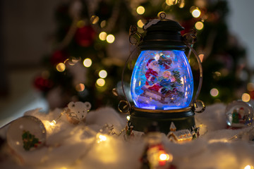 Christmas background with santa in a snow globe
