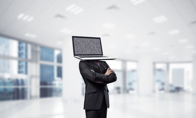 Businessman with laptop instead of head.