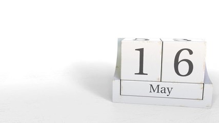 Cube calendar shows May 16 date. 3D animation