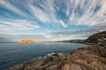 Fototapeta na wymiar Evening sun on red rock of Ile Rousse in Corsica