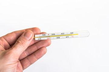 Hand holding a thermometer isolated on white background