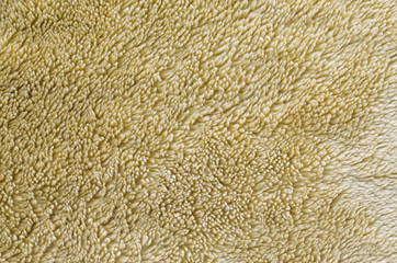 Faux fur texture brownish yellow. Empty blank background