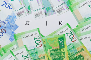 The symbol on the Russian language the Debit and Credit and the new Russian banknotes around