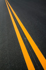Double yellow lines on the asphalt road