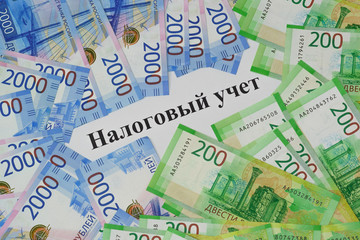 The inscription Tax accounting on the background of new Russian bills