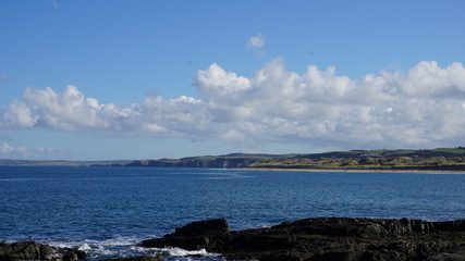 sea with blue sky and clouds