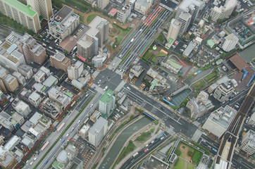 Aerial view of Tokyo cityscape from high above. Dense populated area with many buildings.