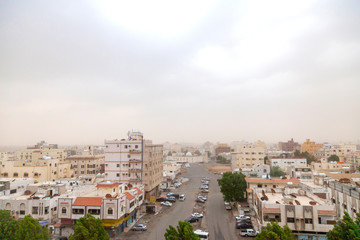 Fototapeta na wymiar Scenery high view of jeddah city and Black sea with cloudy sky before rain in Saudi Arabia.