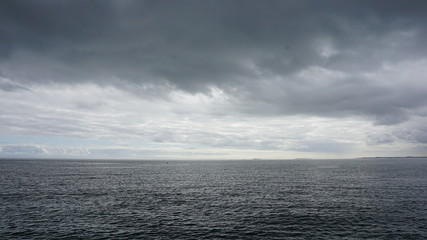 sea with blue sky and clouds