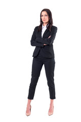 Successful confident elegant business woman with crossed arms looking at camera serious. Full body isolated on white background. 