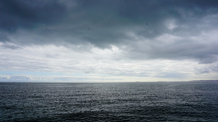 sea with blue sky and clouds