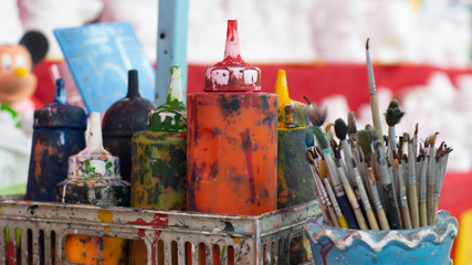 Paintbrush and color bottle